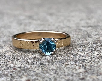unique Montana sapphire engagement ring . teal blue sapphire engagement ring with 14k yellow gold band by peacesofindigo
