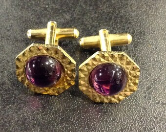 Gold cufflinks with purple stones