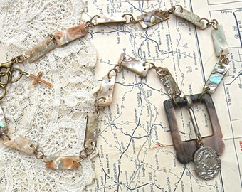 religious assemblage necklace upcycled jewelry found object repurpose neutral catholic medal
