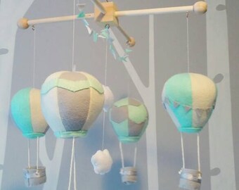 Whimsical, handmade hot air balloon mobile. Gender neutral travel themed.
