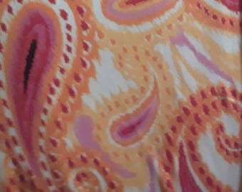 Fabric-poly rayon spandex knit-orange and yellow paisley