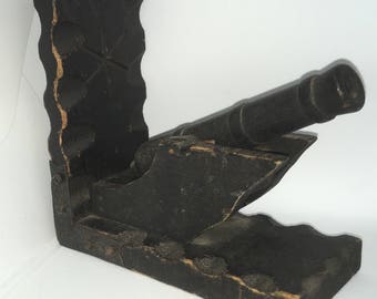 A pair of hand made bookends depicting Napoleonic cannons.
