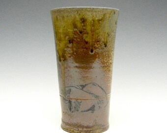 Wood fired cup with natural ash glaze and pigs