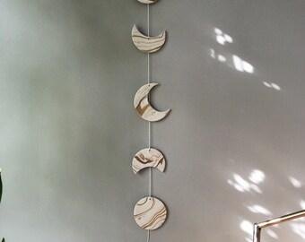 White and gold phases of the moon wall hanging