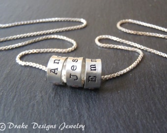 Hand stamped mothers day jewelry with kids names. sterling silver mom necklace