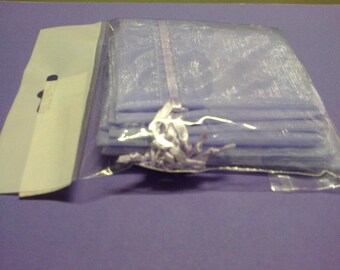Ten purple pouches that closes with a satin ribbon