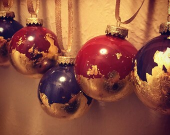 Hand painted gold leaf ornaments marbled in Tuscan Red and Royal Purple