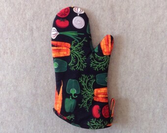 Vegetable print on ebony black background oven mitt