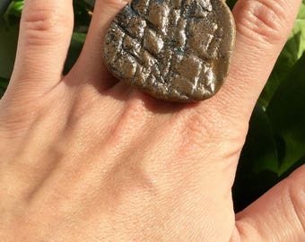 Brown, slightly iridescent, textured ring