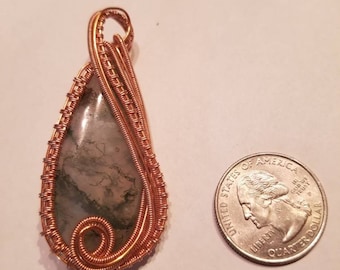 Moss agate wrapped in copper