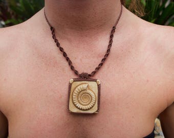 Ammonite Fossil cast on brown thread