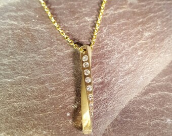 Stunning 9ct Yellow Gold Twisted Pendant with 10 Flush Set 2mm Cubic Zirconium Stones