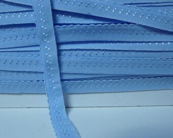 Through elastic 12 mm sky blue edge rounded by the yard