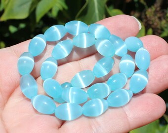 5 ŒIL CAT MEXICAN OPAL 8 X 12 MM OVAL BEADS.