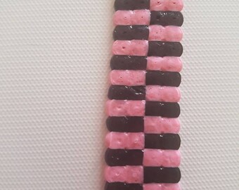pink and black mini bookmark.