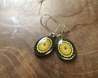 Mandala dangeling earrings: green, blue, yellow and orange. Oval.