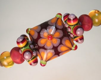 FLOWERED PILLOW FOCAL + Matched Pairs: Stars, Polka-dot Minnies and Topaz Plains Handmade Lampwork Beads by Patti Cahill (7 beads total)
