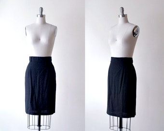 1980's pencil skirt. 80's black skirt. mid-length. rayon skirt. small. 80 black pencil skirt.