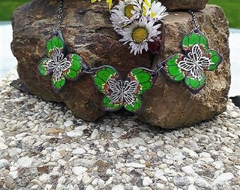 Necklace three green butterflies made of polymer clay.