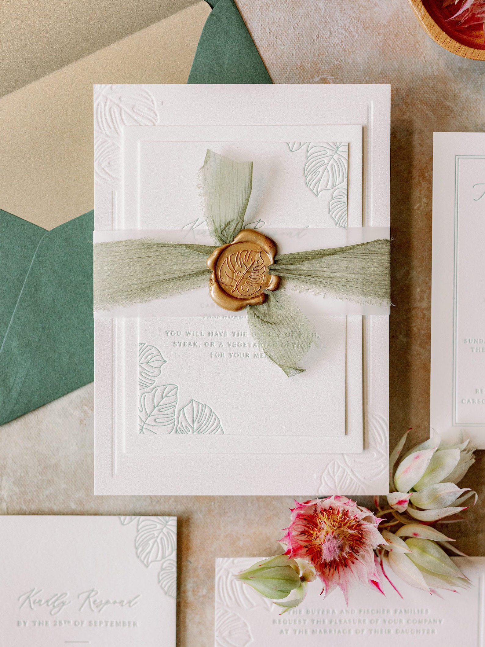 Embossed monstera leaf wedding invitations from Etsy