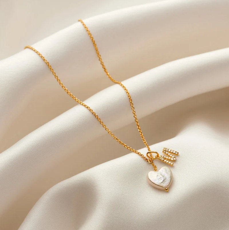 Gold necklace with freshwater pearl and diamond initial