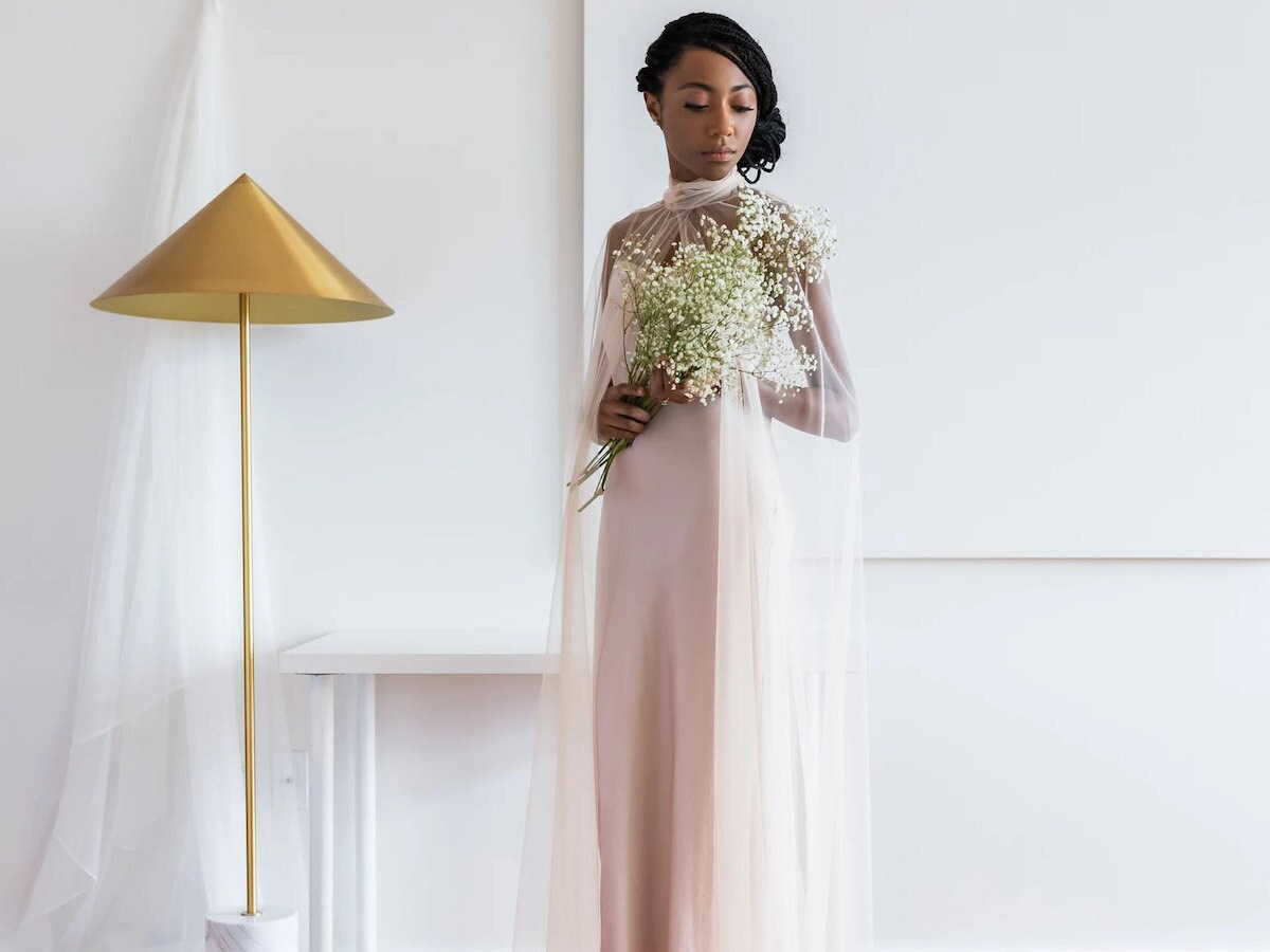 Bridal cape from Etsy modeled with flowers