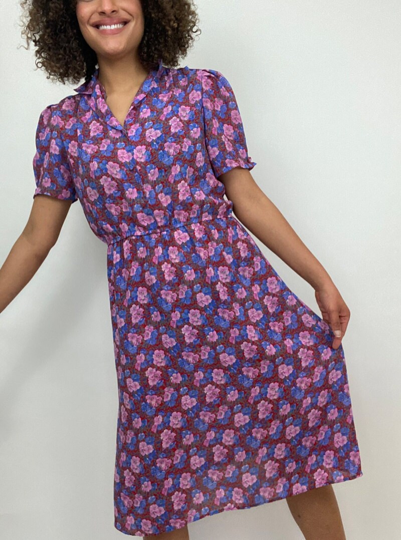 A woman modeling a vintage dress from Etsy.