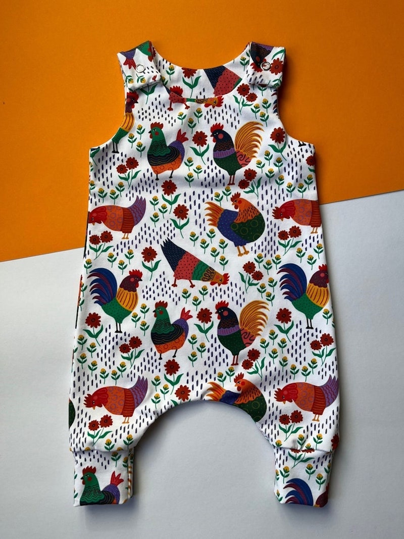 A chicken-print baby romper from Etsy