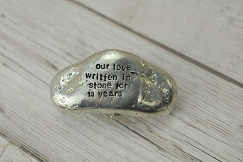 An engraved tin stone from Etsy.