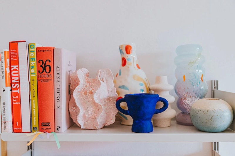 Colorful ceramics displayed on Frauke's shelf Colorful ceramics displayed on Frauke's shelf