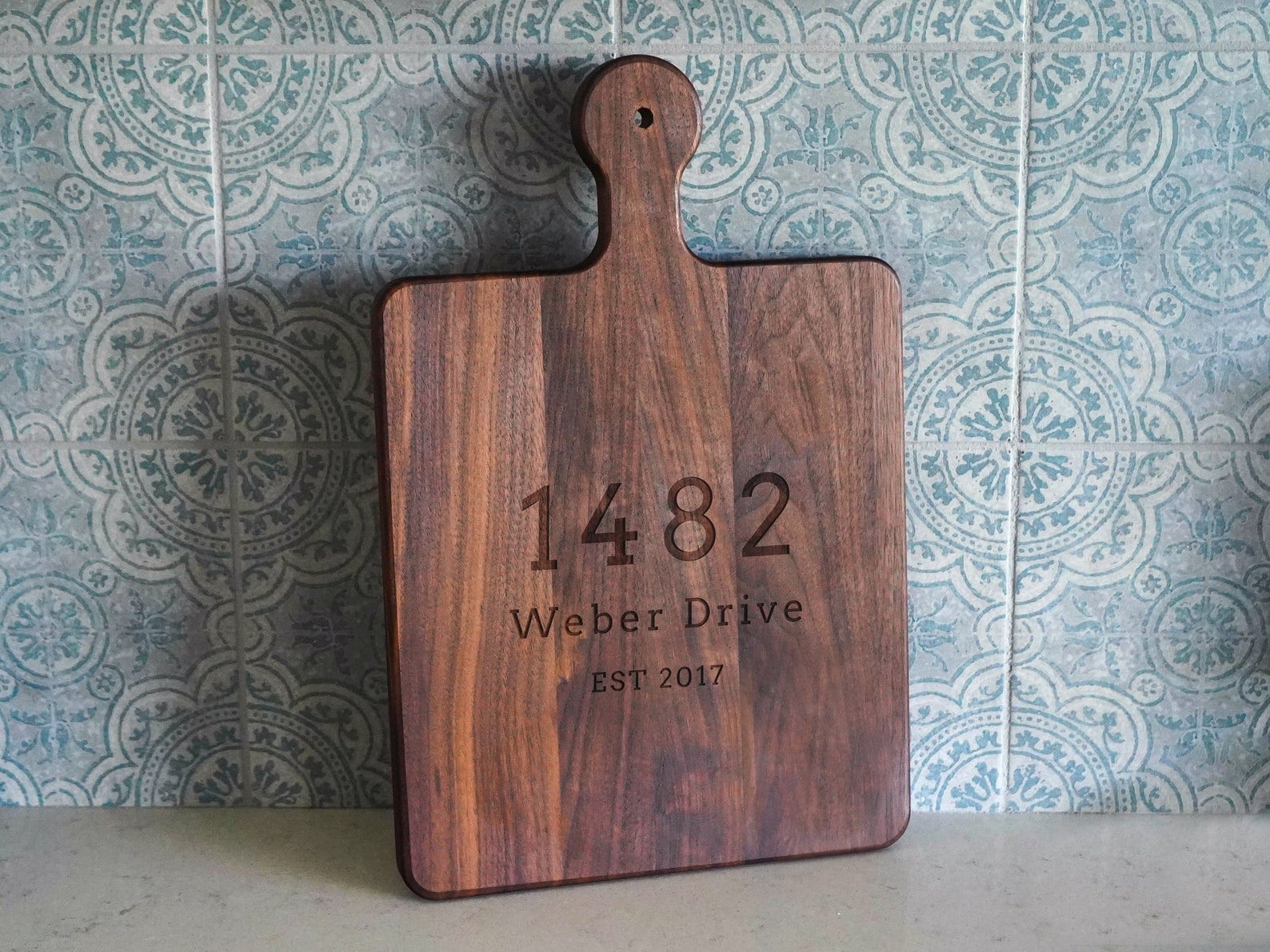 Customized charcuterie board with address from Etsy