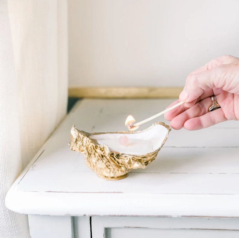 Gold painted oyster shell candle