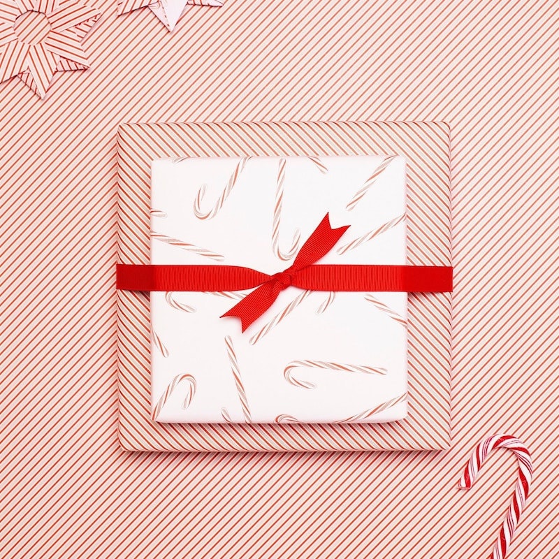 Two gifts wrapped in candy candy wrapping paper.