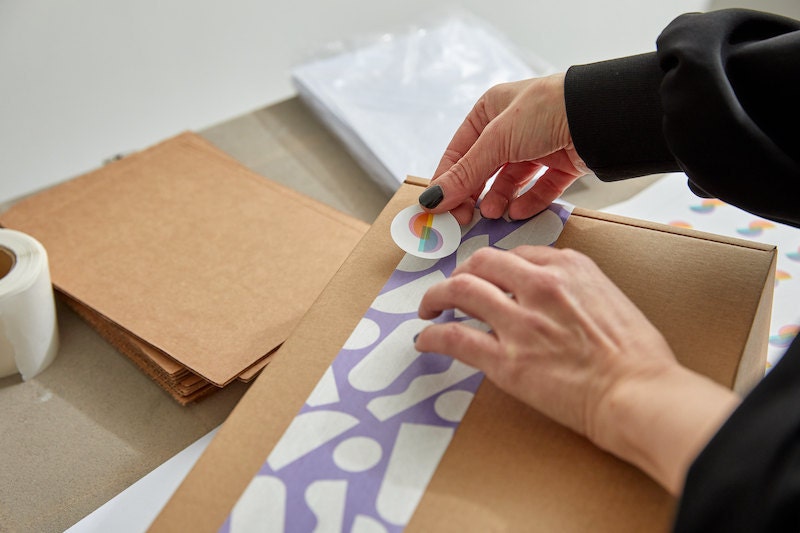 Julieta wrapping an order in her studio.