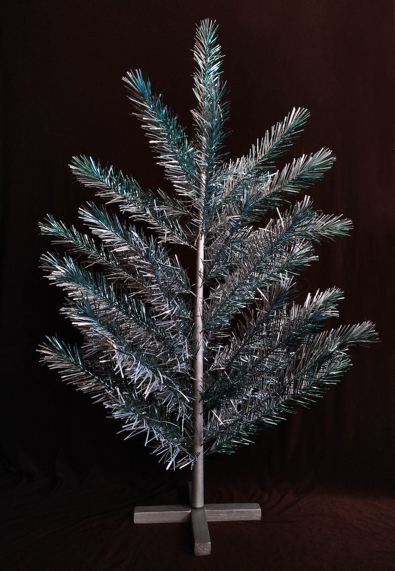 Silver and green aluminum Christmas tree