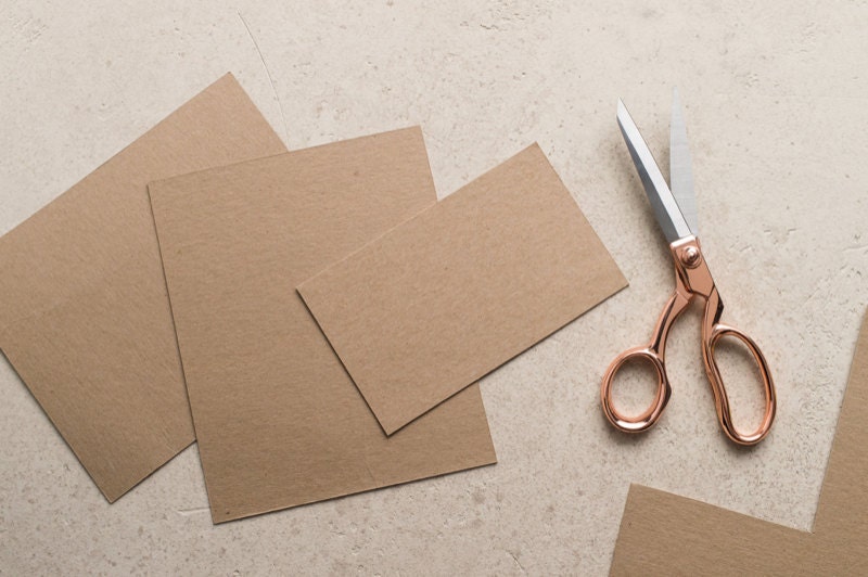Chipboard and scissors. Chipboard and scissors.