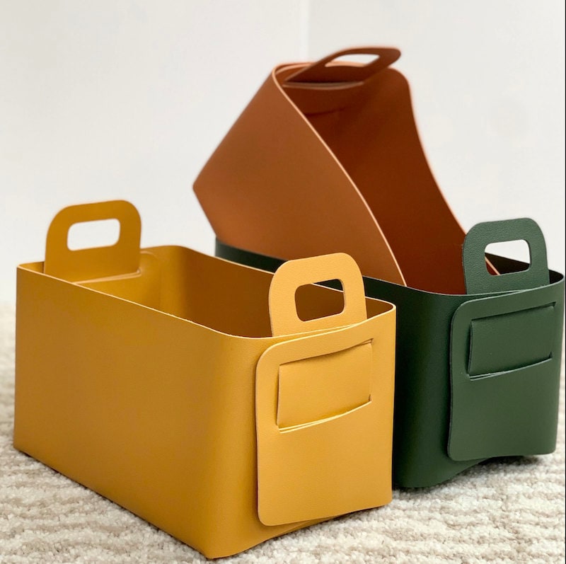 Colorful leather storage baskets from Etsy