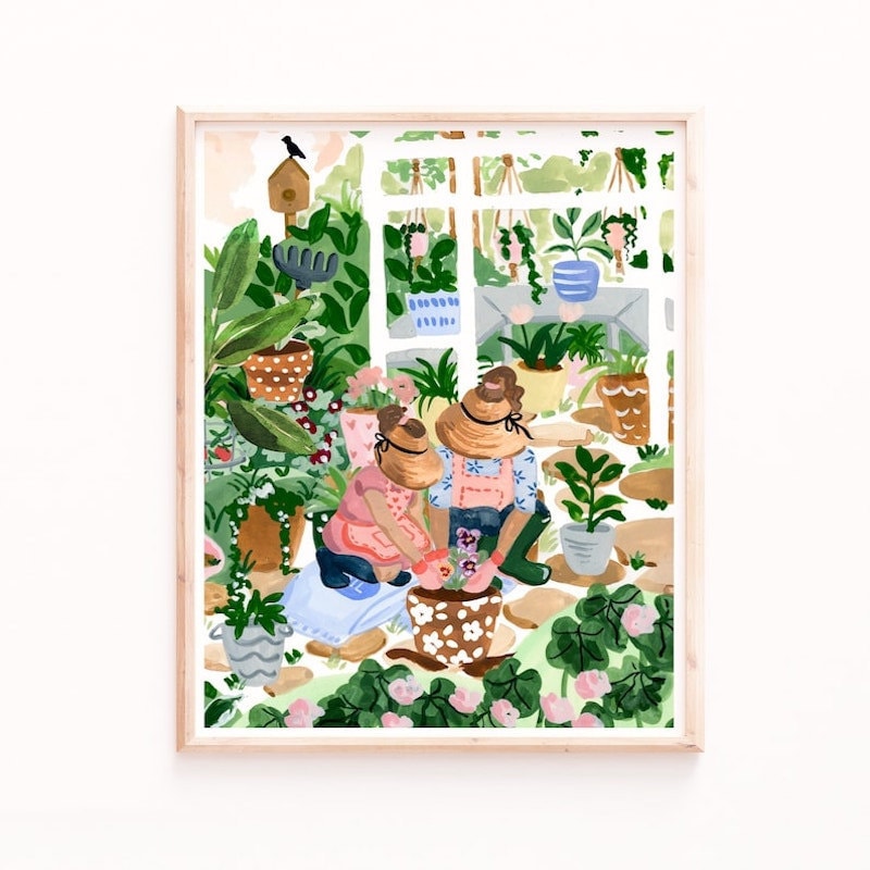 An art print of a mother and daughter planting flowers in their garden from Etsy.