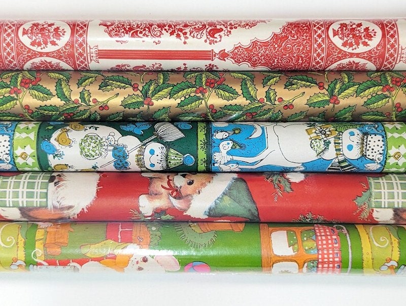 Five rolls of vintage Christmas wrapping paper from the '80s.