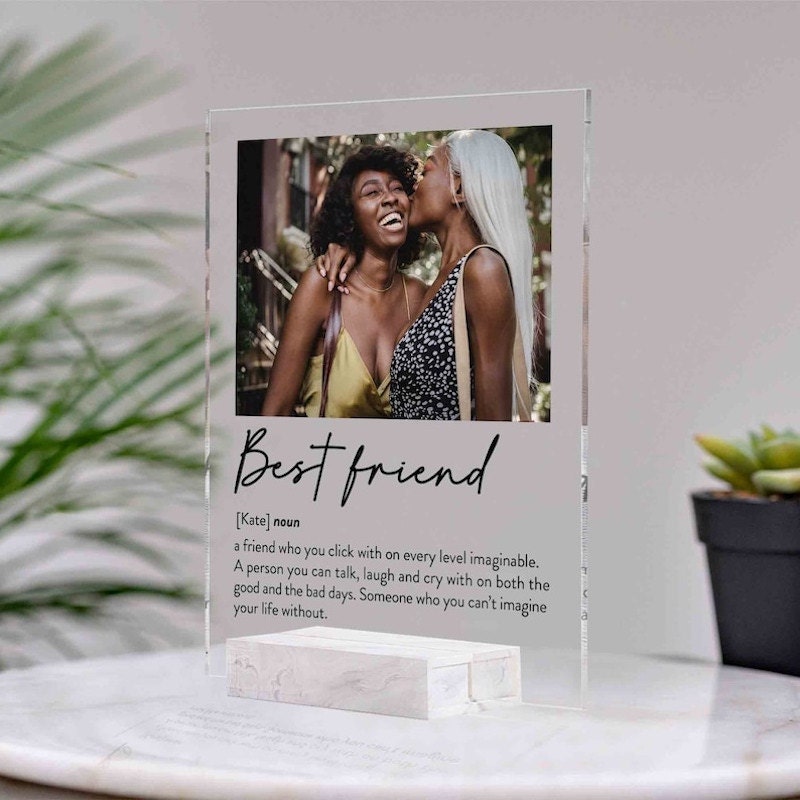 A personalized acrylic photo plaque featuring a photo of best friends and a message.