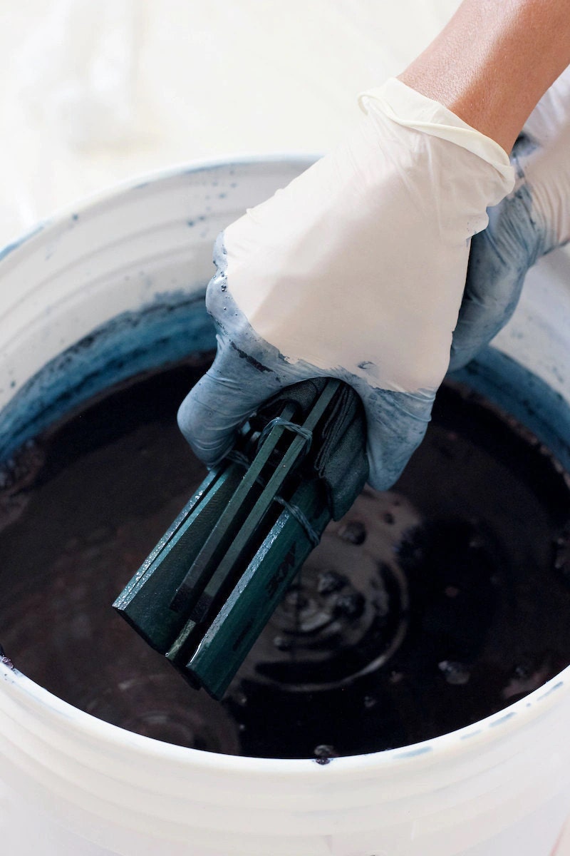 Removing the fabric from the dye bath Removing the fabric from the dye bath