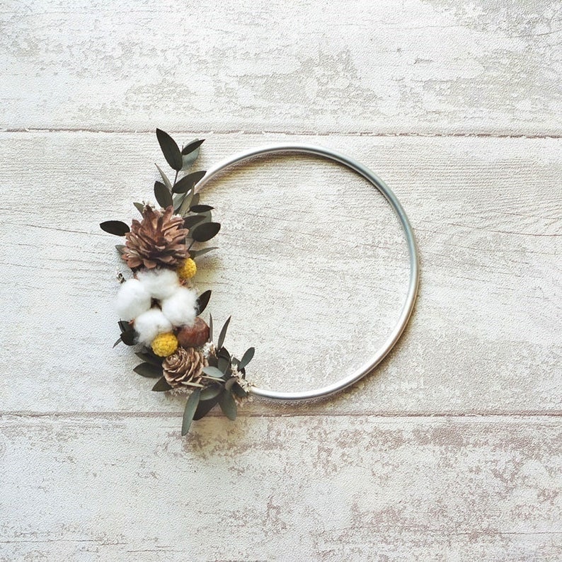 Minimalist fall hoop wreath with fall flower accents.