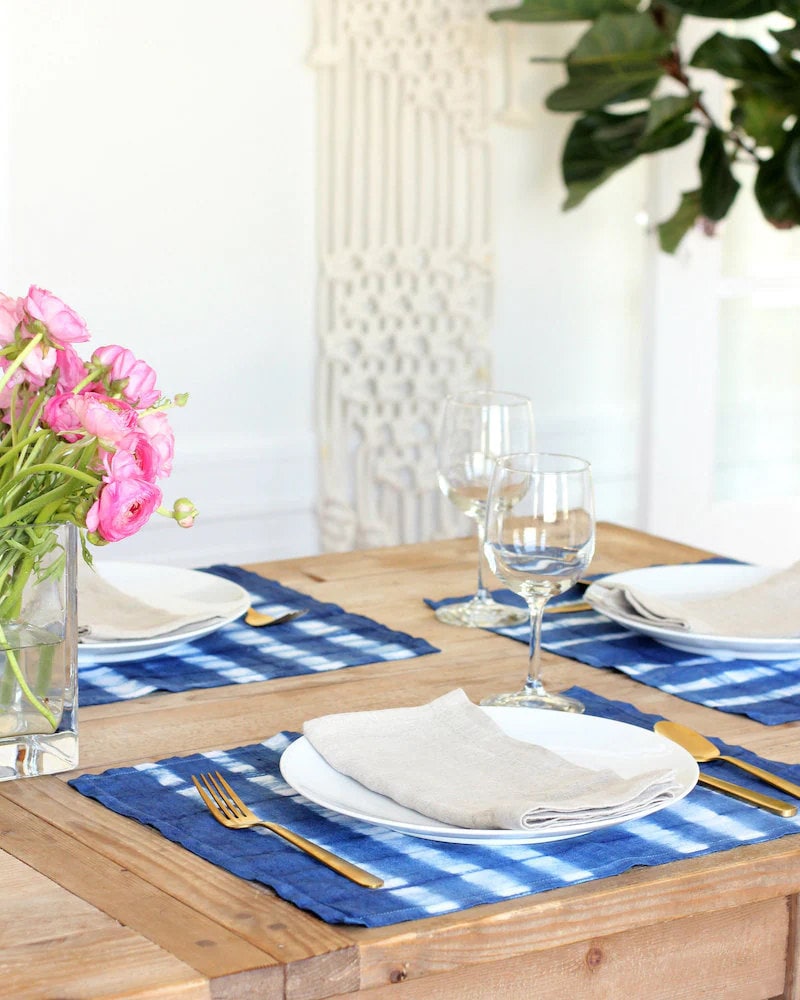 Finished shibori dyed placemats displayed on a table Finished shibori dyed placemats displayed on a table