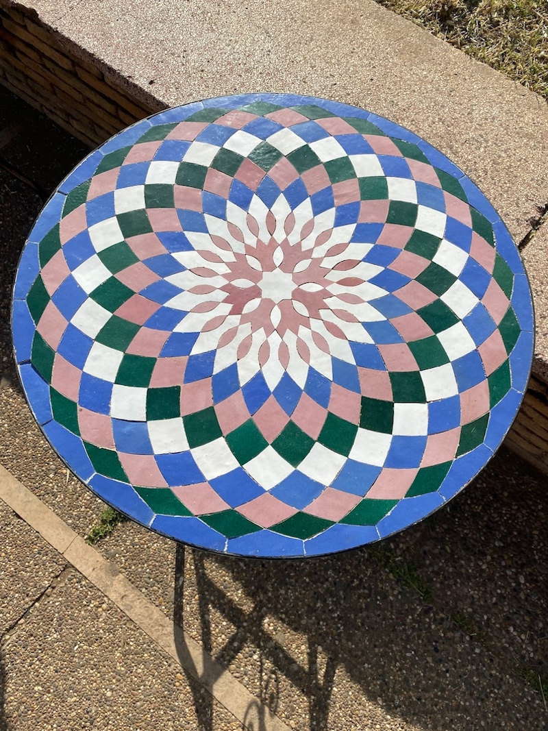 A mosaic tile outdoor side table.