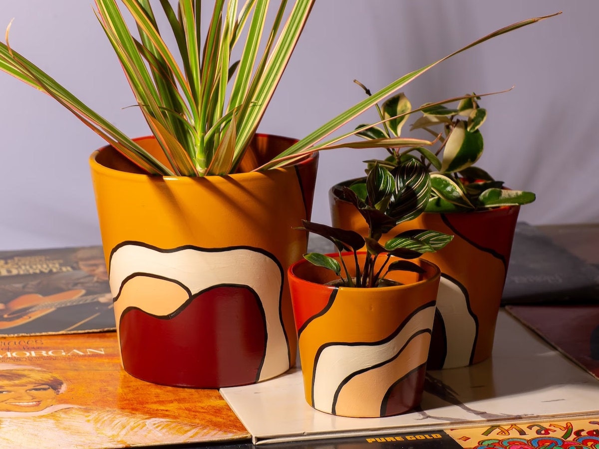 Set of three painted planters Set of three painted planters