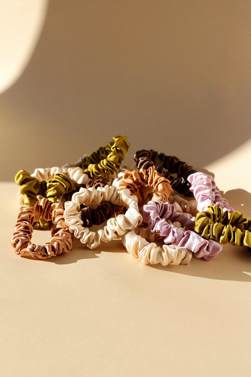 Thin, plant-dyed scrunchies from Marram Designs on Etsy.