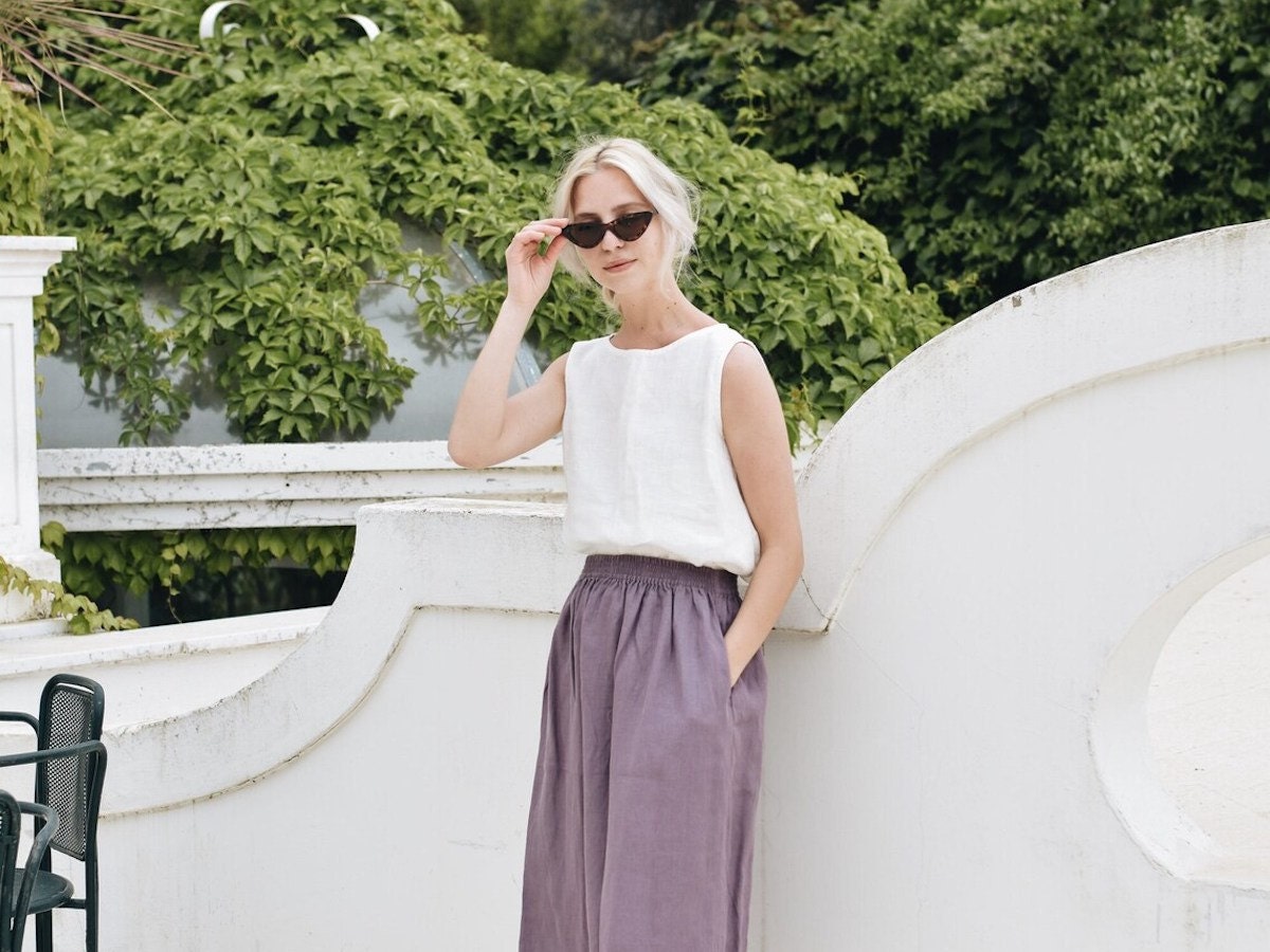 Woman wearing stylish linen outfit standing outside Woman wearing stylish linen outfit standing outside