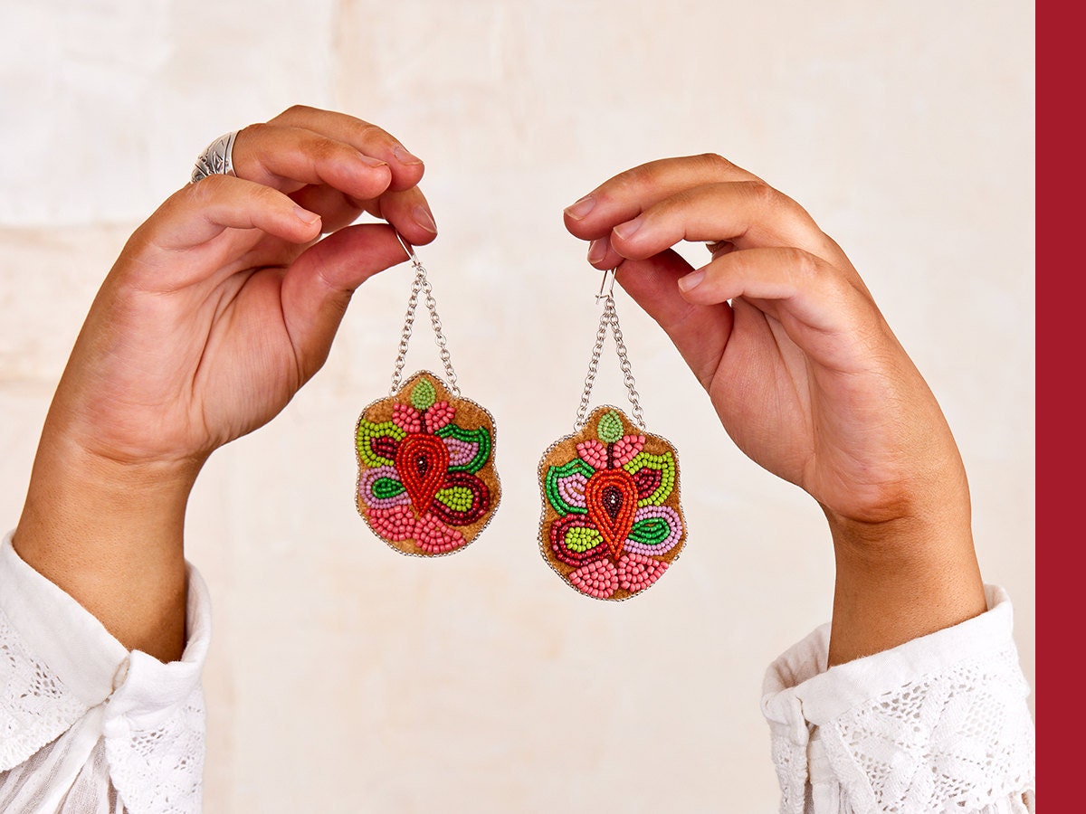 A pair of beaded earrings from the Uplift Makers Indigenous Artisans Collective A pair of beaded earrings from the Uplift Makers Indigenous Artisans Collective