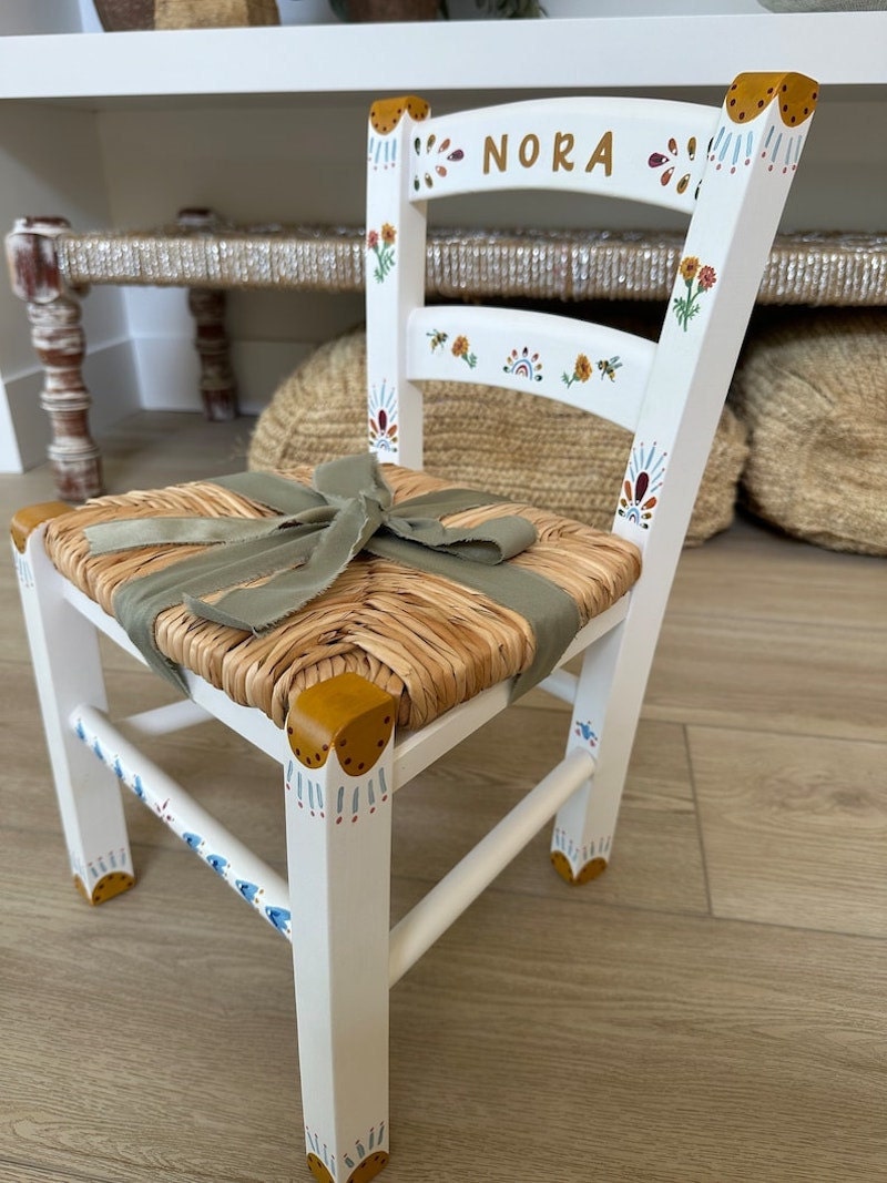 A hand-painted custom children's chair with their name.