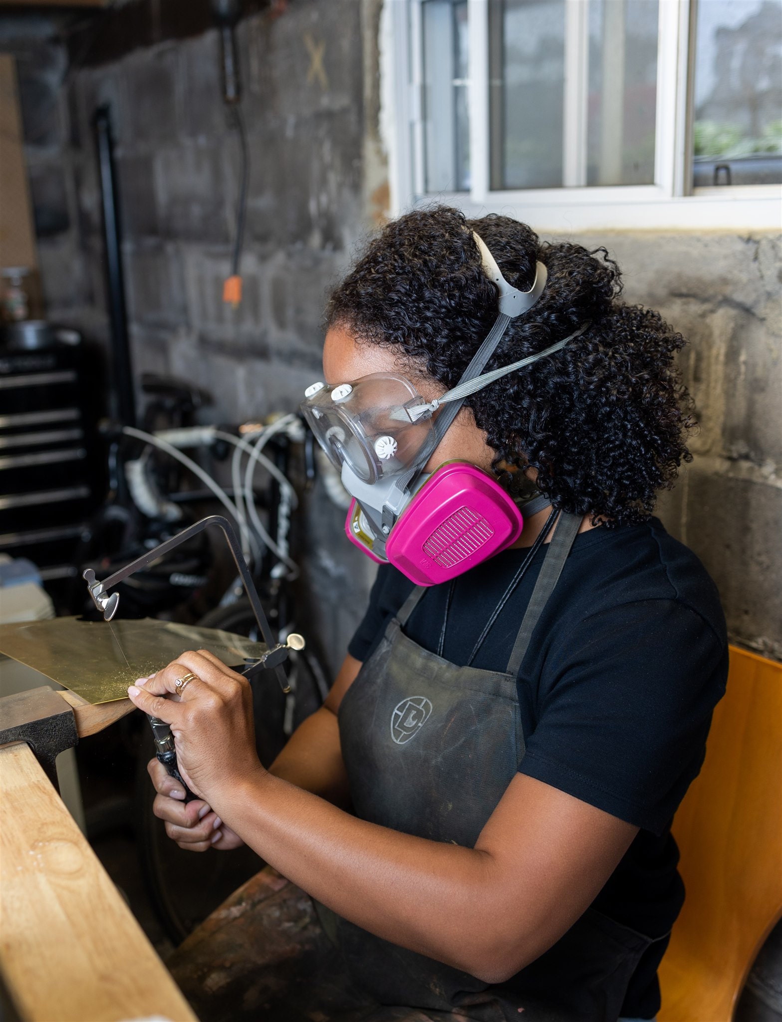 Jordan Clarke making jewelry in her studio.